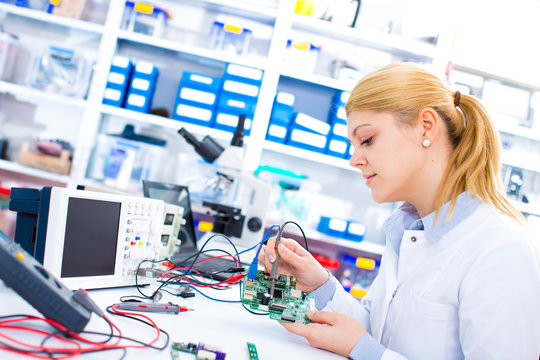 Engineer working with circuits. A woman engineer 