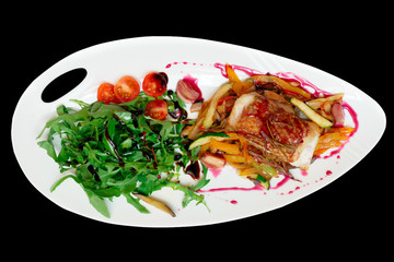 Fish steak with begetable ratatoille and rocket salad, isolated