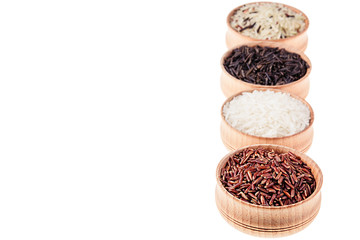 Red, black and white rice close-up in wood bowls on white background. Isolated. Rice texture background.