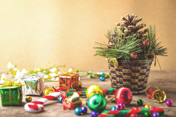 Christmas and new year wooden background banner with gift box, daisy flower, candy ball and decoration on vintage background.