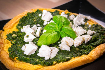 Delicious omelet with spinach and feta cheese