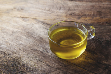 cup of chamomile tea with chamomile flowers