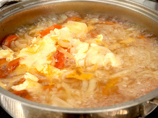 Egg with onion and tomato soup
