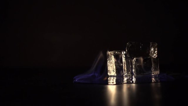 Burning alcohol with around ice cubes