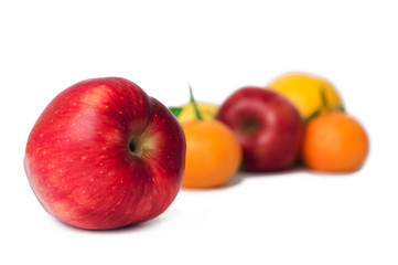 Orange, apple, tangerines and lemons on the white background