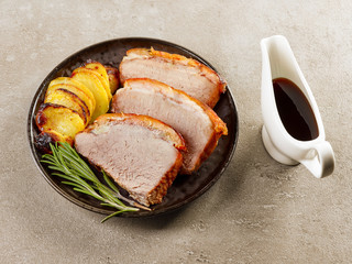 roasted pork slices and potatoes