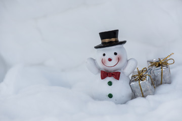 Snowman on wooden table. Christmas decoration.