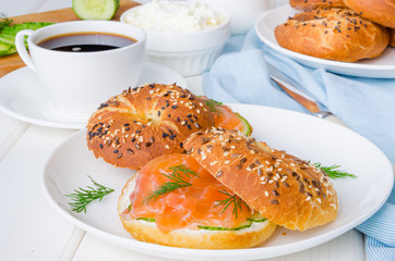 Homemade bagels with cream cheese, cucumber and smoked salmon for breakfast