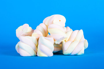 heap of marshmallow on blue