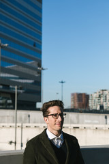 Young handsome man posing in an urban context