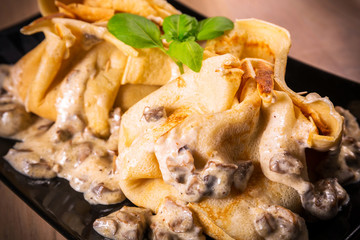 Pancakes with chicken and mushroom sauce