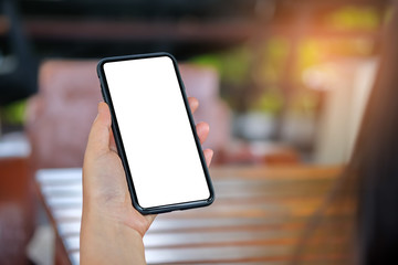 Hand holding a smartphone with white.