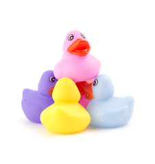 Rubber ducks working together to hold one up - concept of teamwork