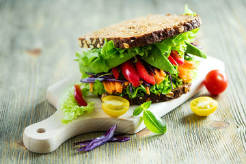 Vegan rye wholegrain fresh sandwich with ingredients for healthy meal, vitamin and diet food - 129200202