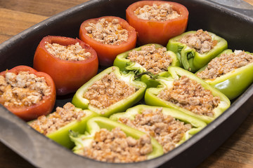 Peppers and tomatoes stuffed with meat