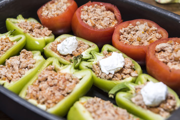 Peppers and tomatoes stuffed with meat