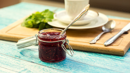 raspberry jam in a jar. selective focus