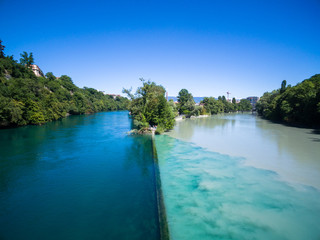 Fototapeta premium Aerial view of Arve an Rhone river confluent in Geneva Switzerl