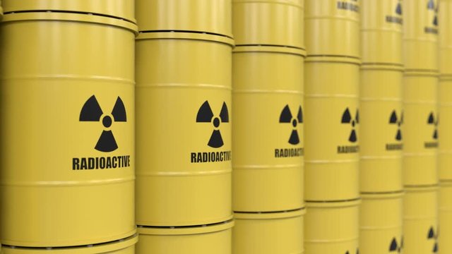 Yellows barrels containing radioactive material. Tracking shot
