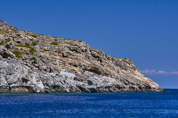 Fototapeta na wymiar rocky cliff at the edge of the Mediterranean Sea, on the island of Rhodes.