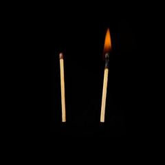 two matches. burning one and one is not burning