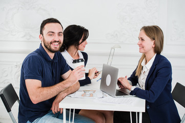 Young couple meeting architect for future house