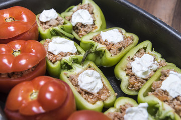 Peppers and tomatoes stuffed with meat