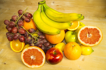 mix of fruits on wooden background