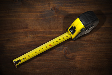 Tape Measure on a Wooden Work Table