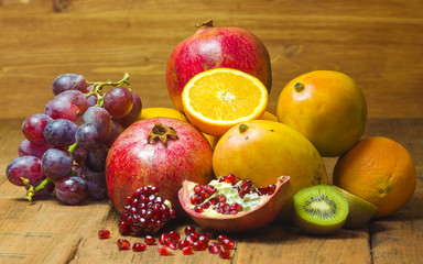Fototapeta na wymiar mix of fruits on wooden background