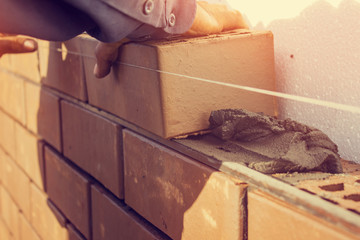 Bricklaying under unravel. construction work.