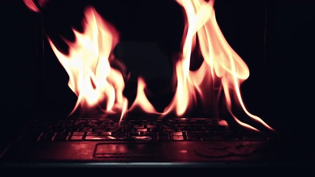 4k Shot of Laptop Burning in Fire Flames
