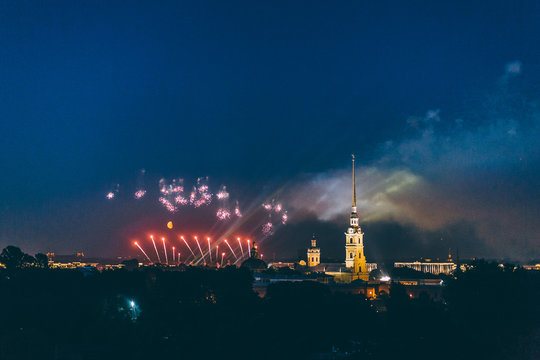Fireworks over the city of St. Petersburg (Russia) on the feast of "Scarlet Sails", in the rain with fog and smoke.
