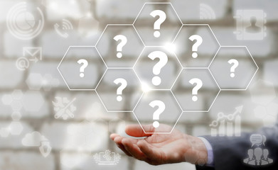 Businessman keep question icon set on virtual screen. Support question and answer faq help service business concept.