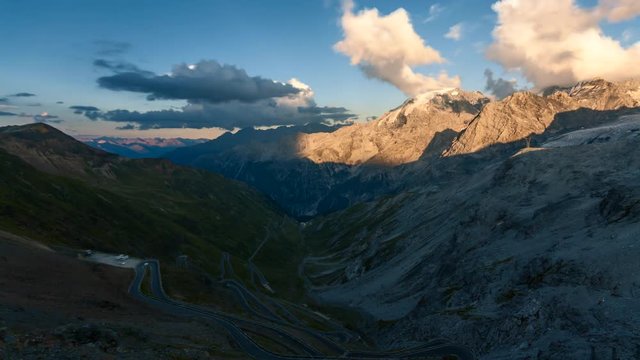 Timelapse video of Stelvio Pass in the Alps, popular tourist destination on summer evening
