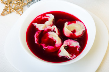 Red borsch with dumplings, traditional Polish Christmas Eve dish