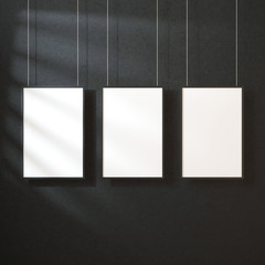 Three White posters Mockup with black frame hanging on the wall with shadows, 3d rendering