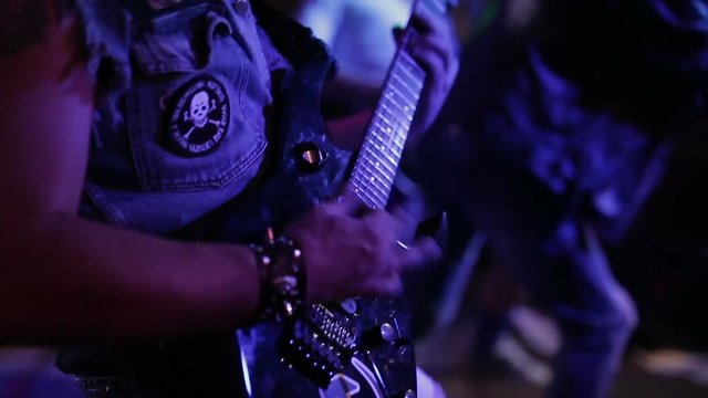 Rock musicians perform in the bar