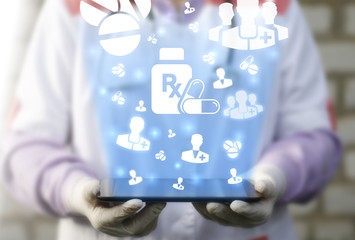 Pharmacy medicine health care RX concept. Doctor holding tablet computer with capsule pill icon network doctor people drug signs. Treatment medicament. Prescription drugs. bottle with rx sign.