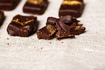 Chocolate candies on sackcloth.