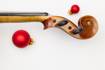 Top view close up shot of old violin and Christmas decoration.