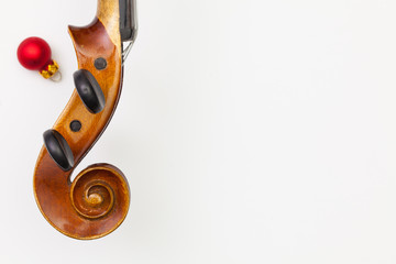 Top view close up shot of old violin and Christmas decoration.