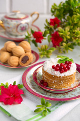 Breakfast with pastries and a drink on a light background