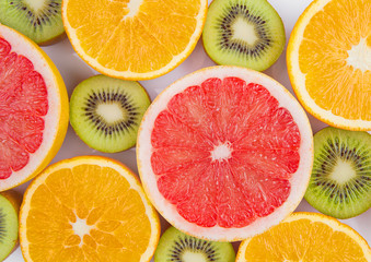 Fruits mix grapefruit orange and kiwi close up