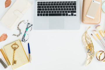 Modern laptop keyboard with golden woman accessories mock up flat lay styled scene, top view, copy space on white table background