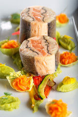 fish starter food on white plate with christmas decoration. product photography and modern gastronomy