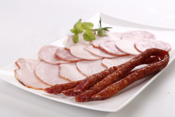 kabanos and ham on white background 