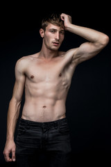 Fototapeta premium handsome shirtless young man posing in studio