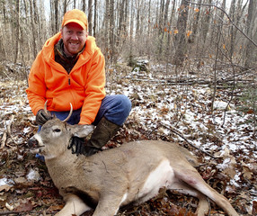 Wisconsin deer hunter with a buck
