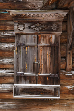 Traditional rural wooden house at winter